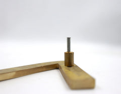 Brass number sign with a screw on a white background