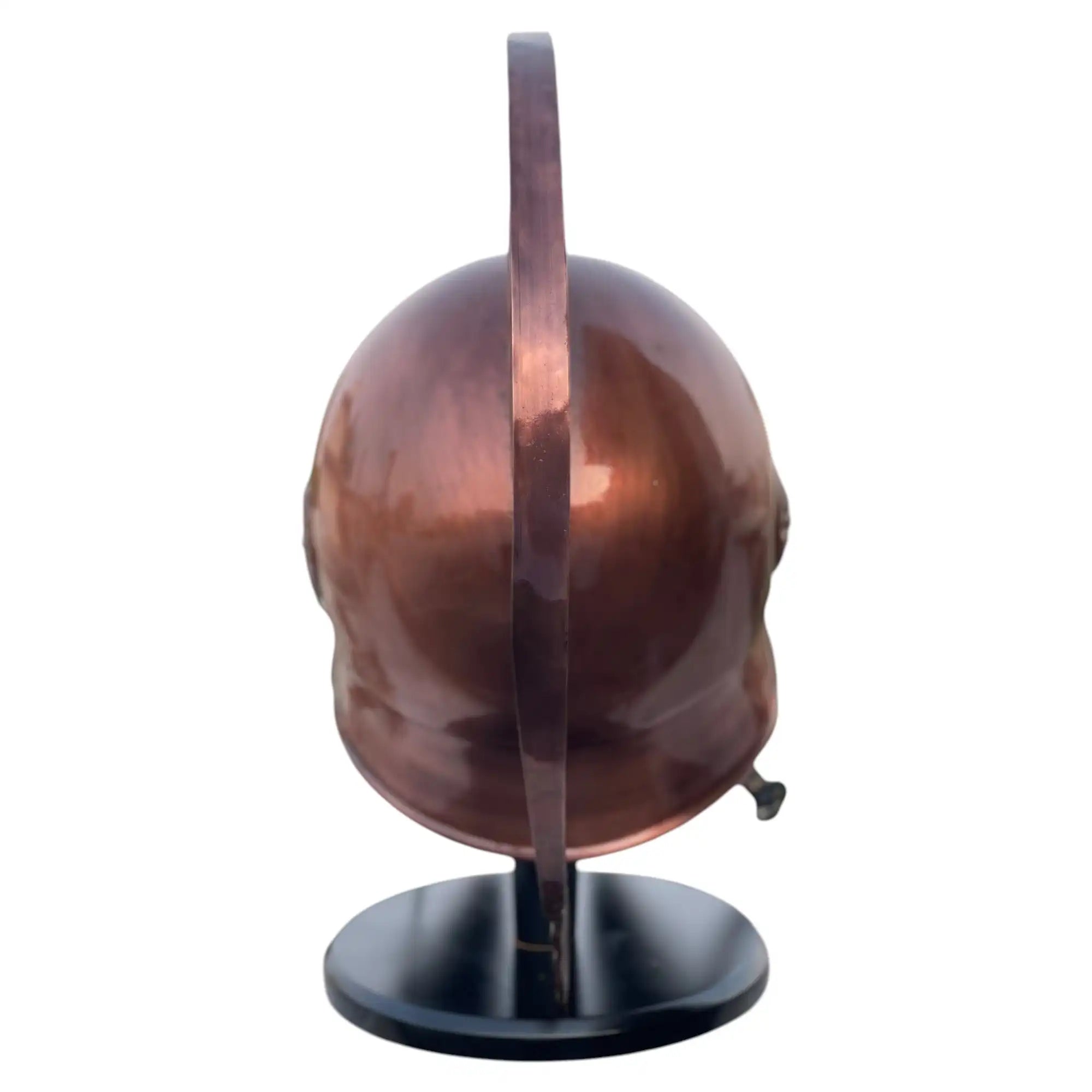 Copper helmet on a black stand against a white background