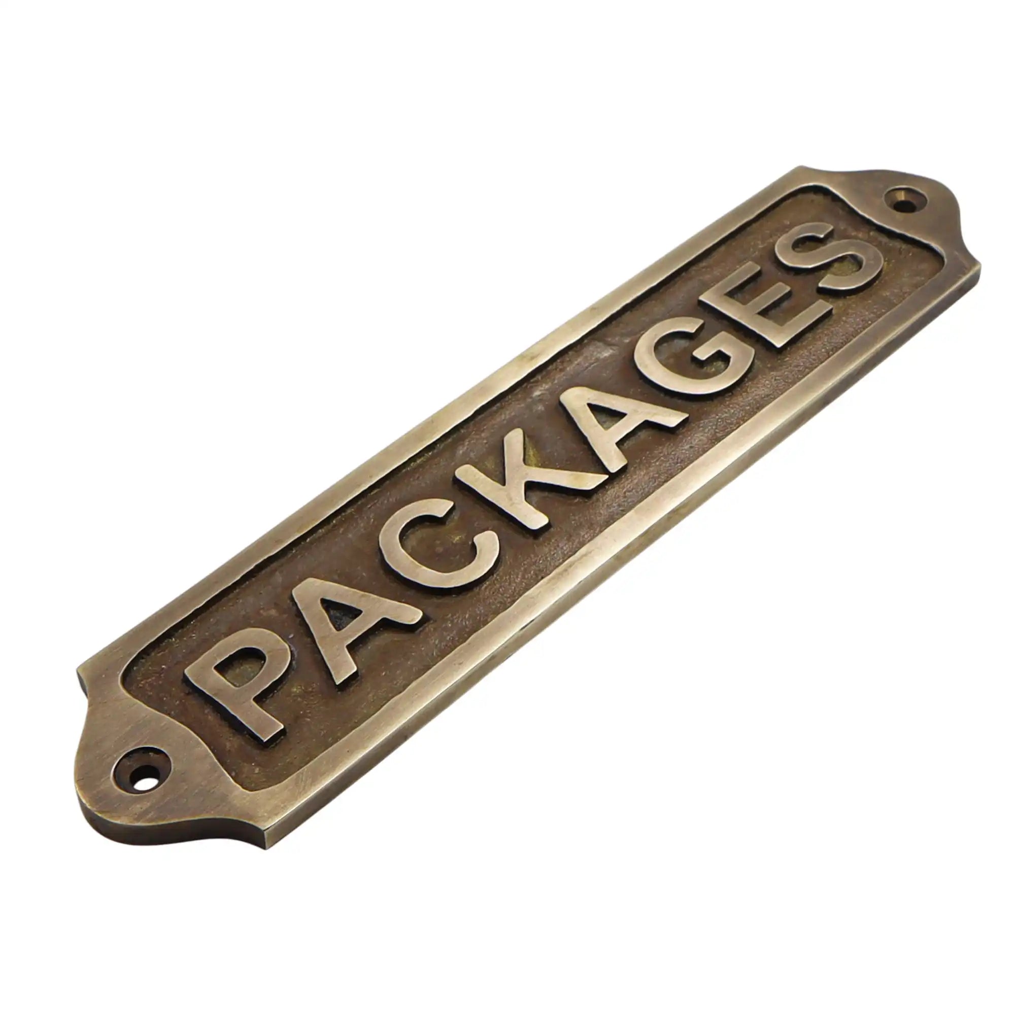 Bronze sign with 'PACKAGES' text on a white background