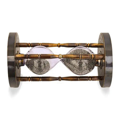 Hourglass with sand running through on a white background