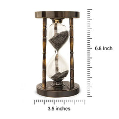 Hourglass with bronze casing and sand measurement on a white background
