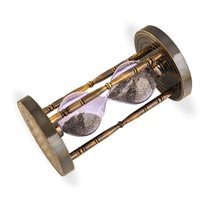 Hourglass with sand running through on a white background