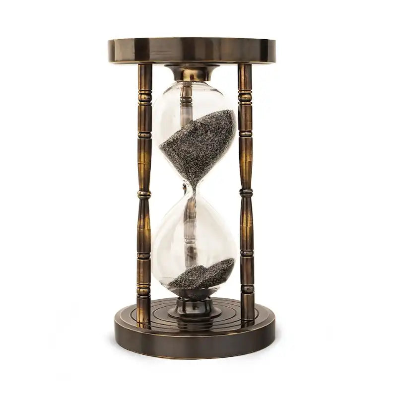 Sand timer hourglass with bronze metal casing on a white background