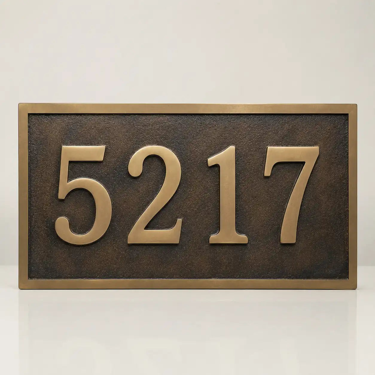 Custom brass sign with black and silver engraved lettering
