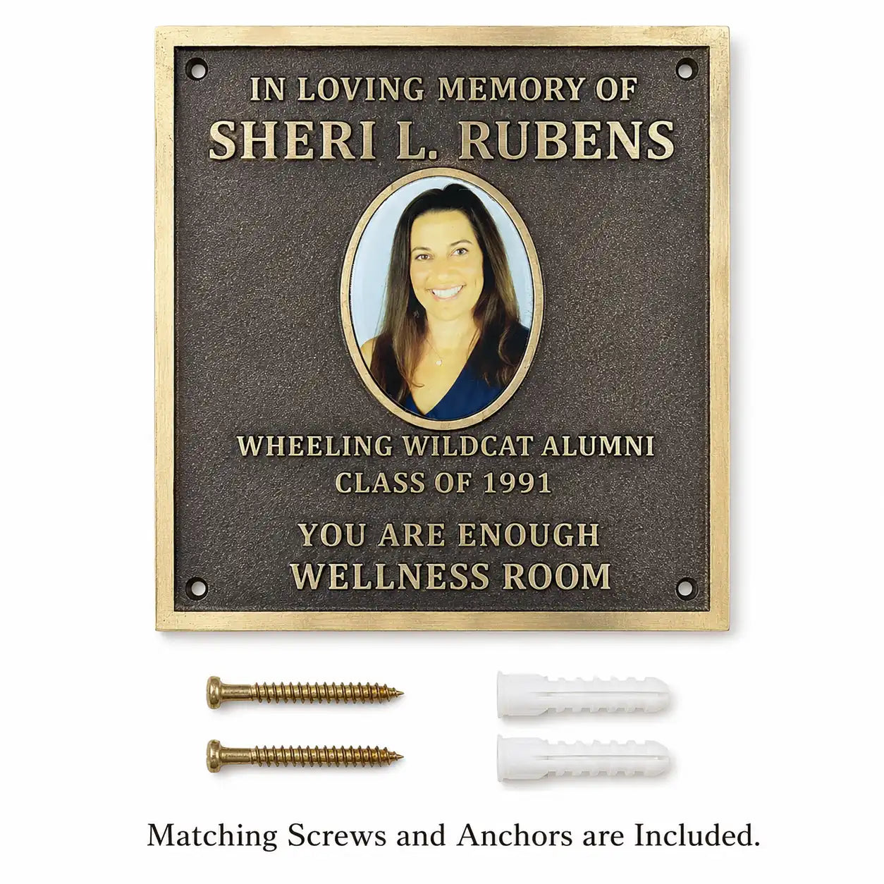 Bronze memorial plaque with engraved picture and personalized inscription displayed with mounting screws and wall anchors.