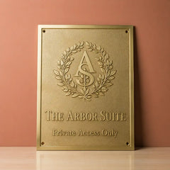 Custom brass wall plaque with family name and address