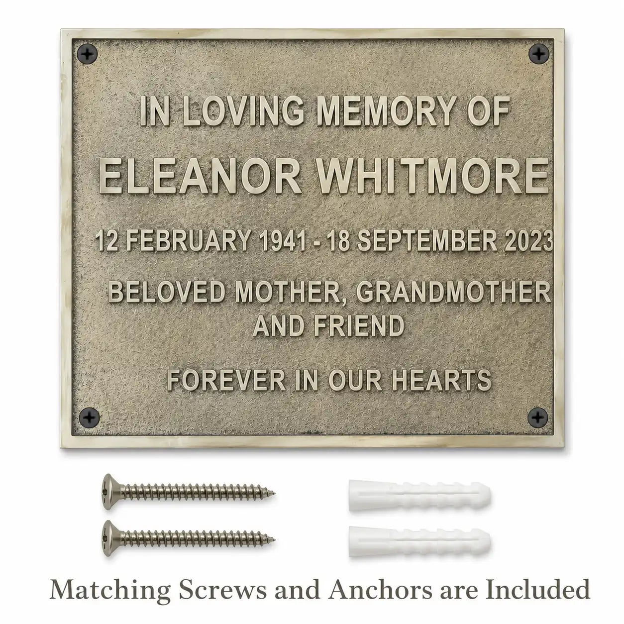 Premium Brass House Number Plaque shown with included fixing screws and wall anchors.