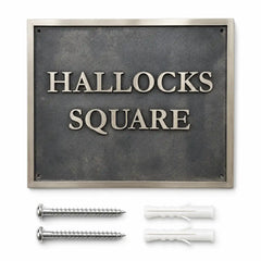 Personalized metal house plaque displayed with included screws and wall anchors on a clean white background.