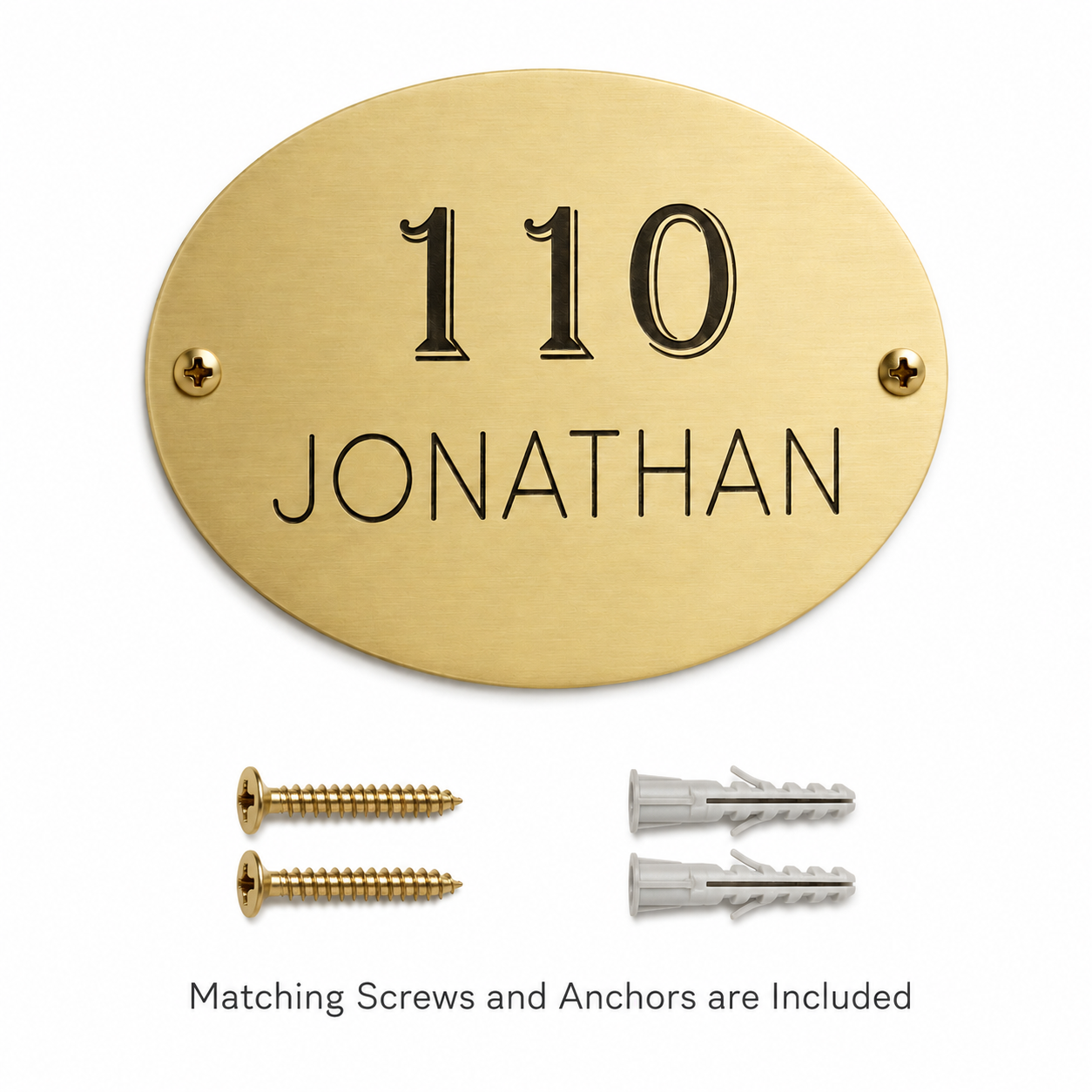 Oval Brass Plaque displayed with two mounting screws and two wall anchors included for installation.