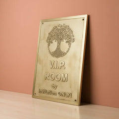 Engraved brass sign for home with  text on a pink background