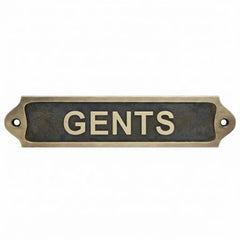 bronze metal sign with 'GENTS' text on a white background