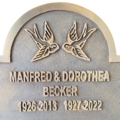 bronze or brass memorial plaque commemorating Manfred and Dorothea Becker. 