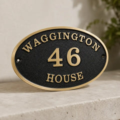 Custom oval brass address plaque for front door or gate