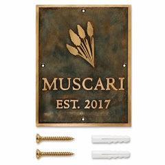 Custom brass address plaque displayed with two mounting screws and two wall anchors included for secure and easy installation.