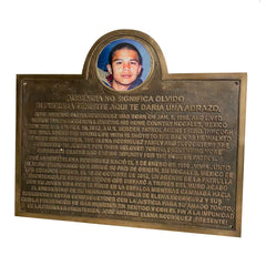 bronze memorial plaque with picture
