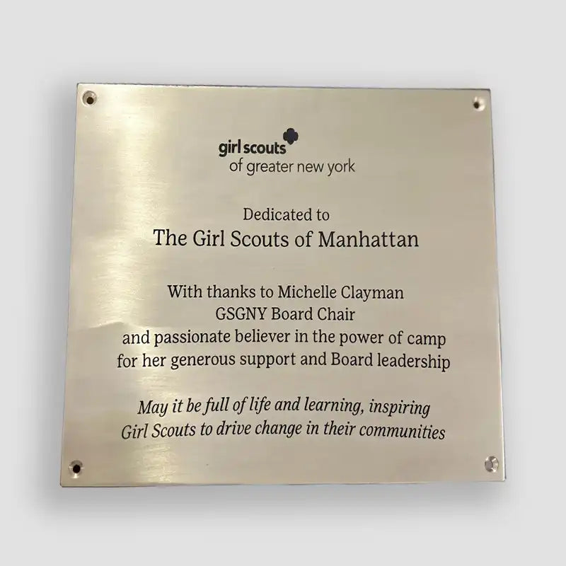 Brass plaque dedicated to Girl Scouts of Manhattan with engraved text, Brass plaque with personalized engraving