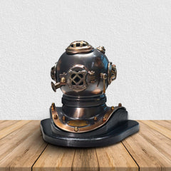 Vintage diving helmet on a wooden surface with a white background