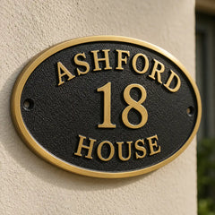 Engraved bronze address plaque in oval shape for outdoor use