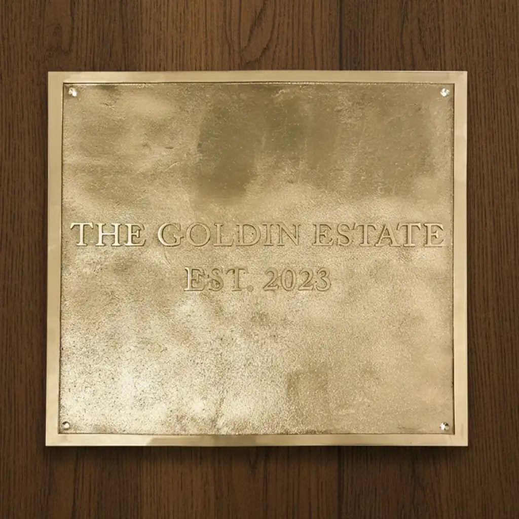 engraved brass address plate polished finish | Brass plaque with on a wooden background