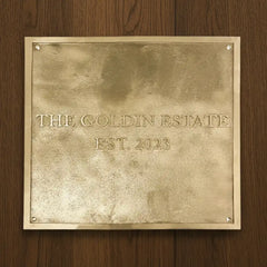 engraved brass address plate polished finish | Brass plaque with on a wooden background
