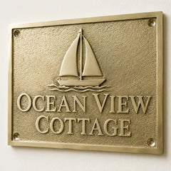 Engraved brass door plaque with gold background