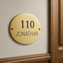 Handcrafted oval brass plaque with custom lettering