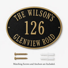 Personalized bronze oval address plaque displayed alongside included mounting hardware on a clean background.