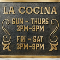 Custom bronze plaque with engraved text for outdoor display