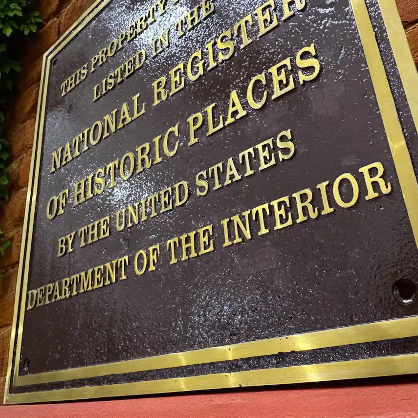 National Register of Historic Places plaque on a brick wall, historic building recognition plaque