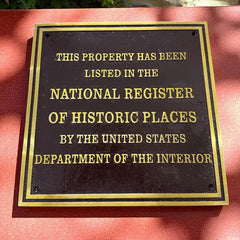 Plaque indicating listing in the National Register of Historic Places on a red background, national register plaque custom made