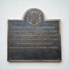 Memorial plaque with names and dates on a white background