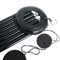 Black Corinthian bell wind chime with circular components on a white background