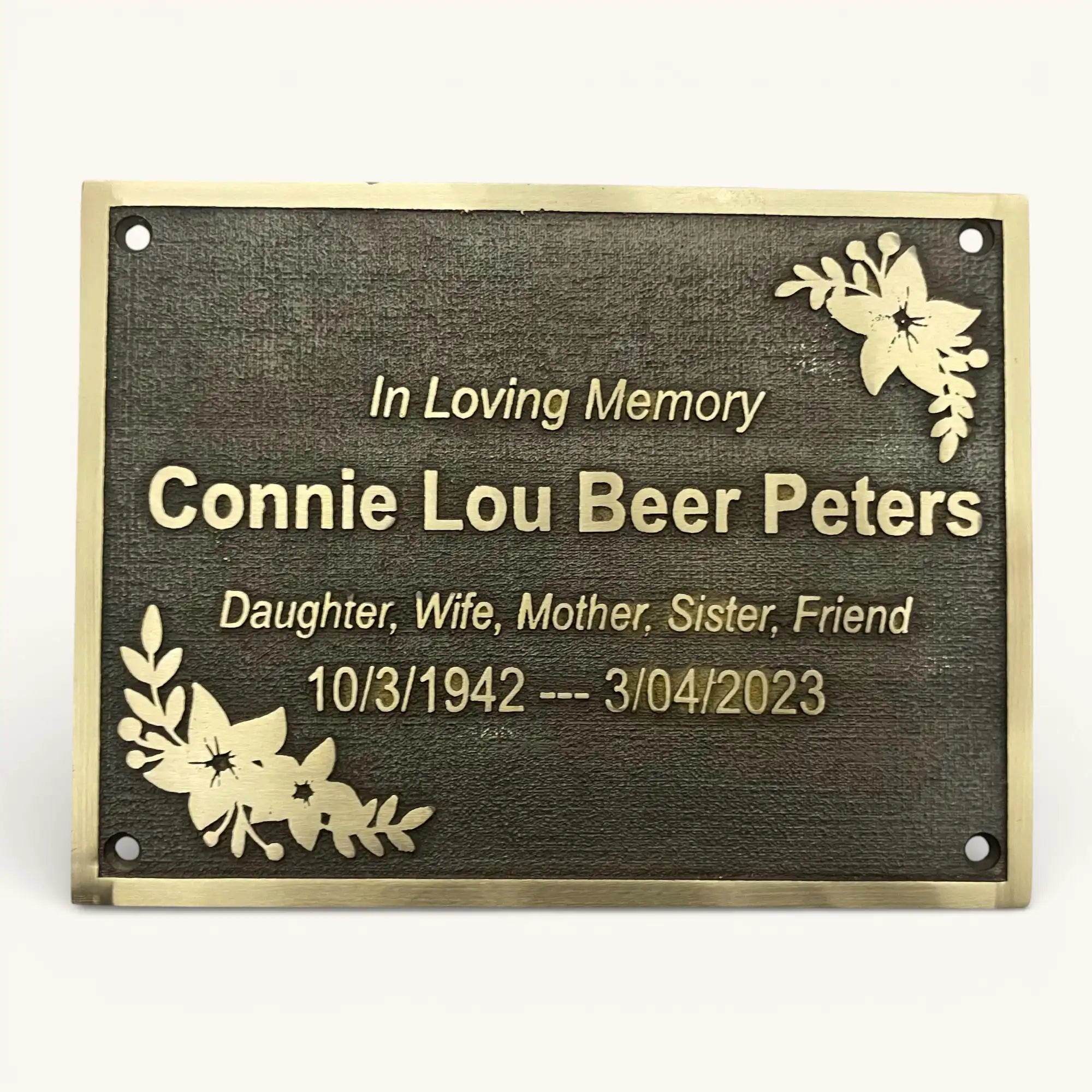Memorial plaque with engraved text 'In Loving Memory Connie Lou Beer Peters' on a white background