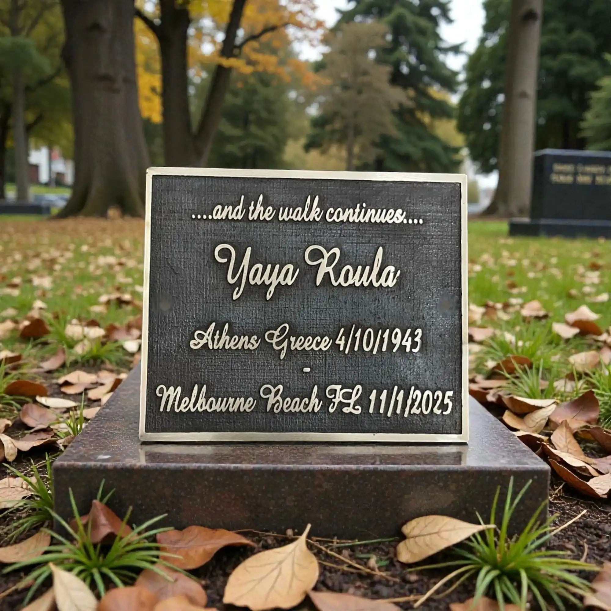 Memorial plaque with engraved text in a park setting