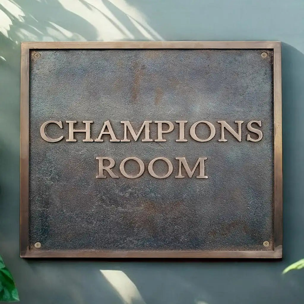 Bronze address plaques with text on a textured surface