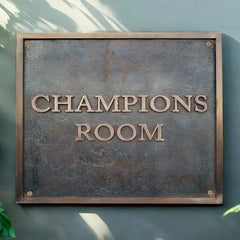 Bronze address plaques with text on a textured surface
