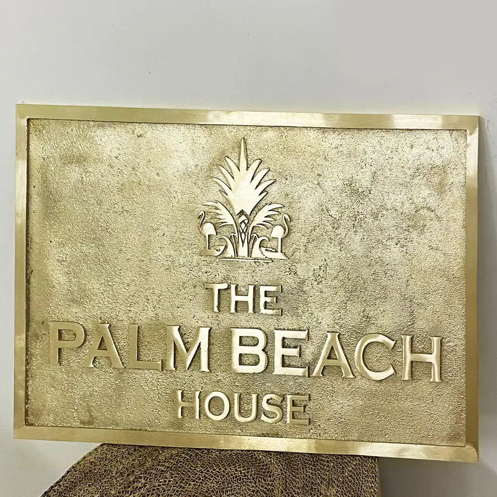 solid brass engraved address plate with logo on a white background