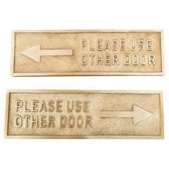 Please Use Other Door brass door sign front view with engraved text on polished brass plaque