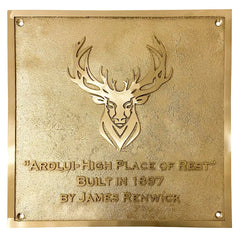 Handcrafted brass house plaque, gold plaque with deer emblem and text on a white background