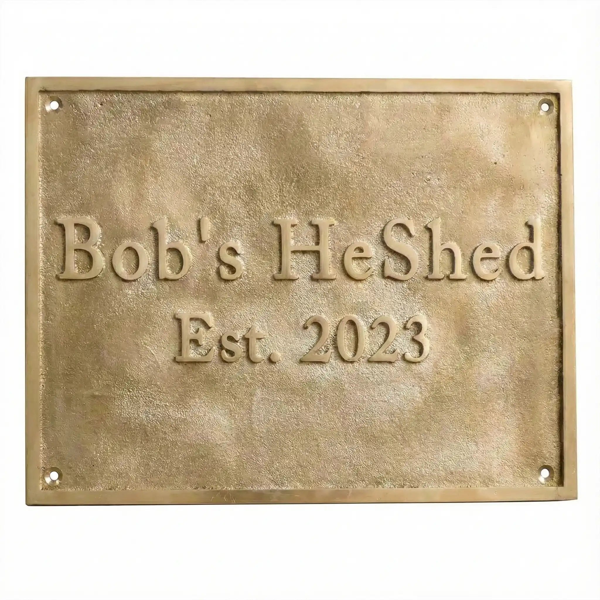Brass plaque with text on a white background