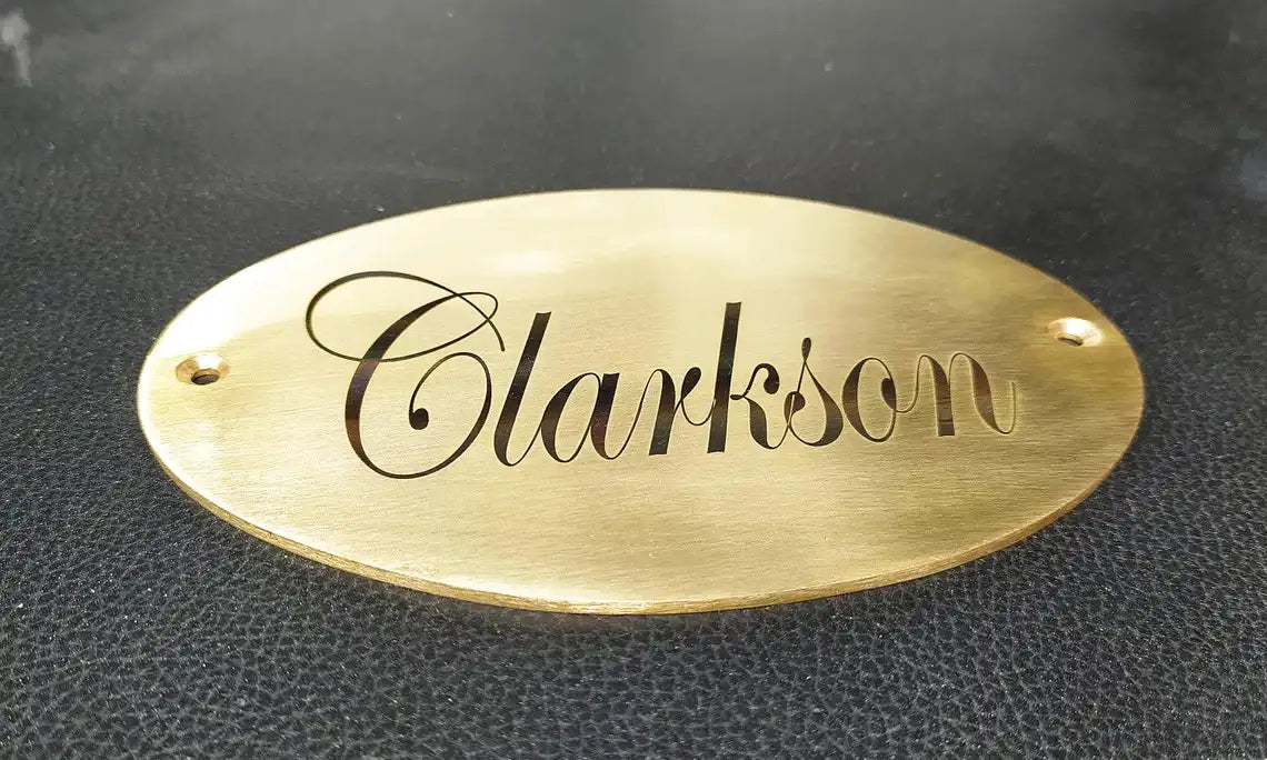 Engraved oval brass tag