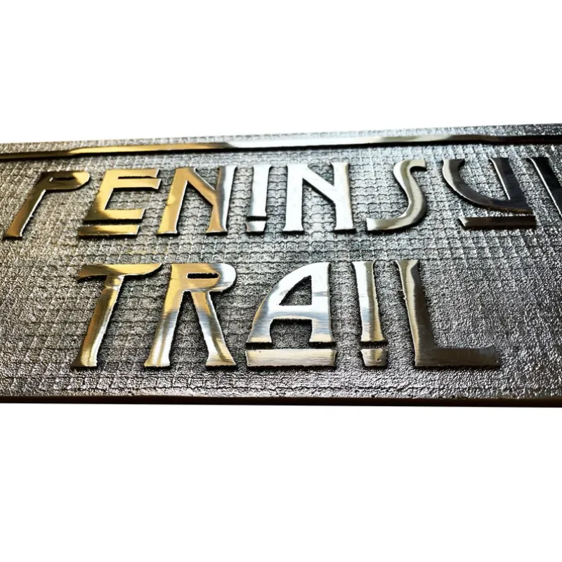 Close-up of a brass and bronze plaque